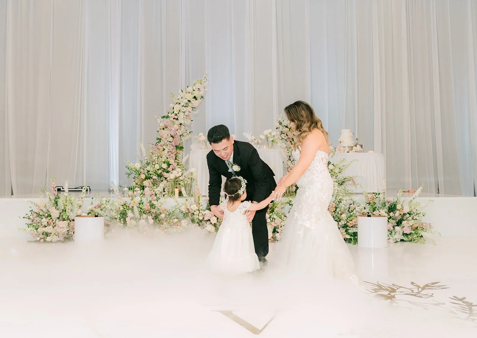 Candice and Vincent dancing with their daughter, photographed by One and Only Production