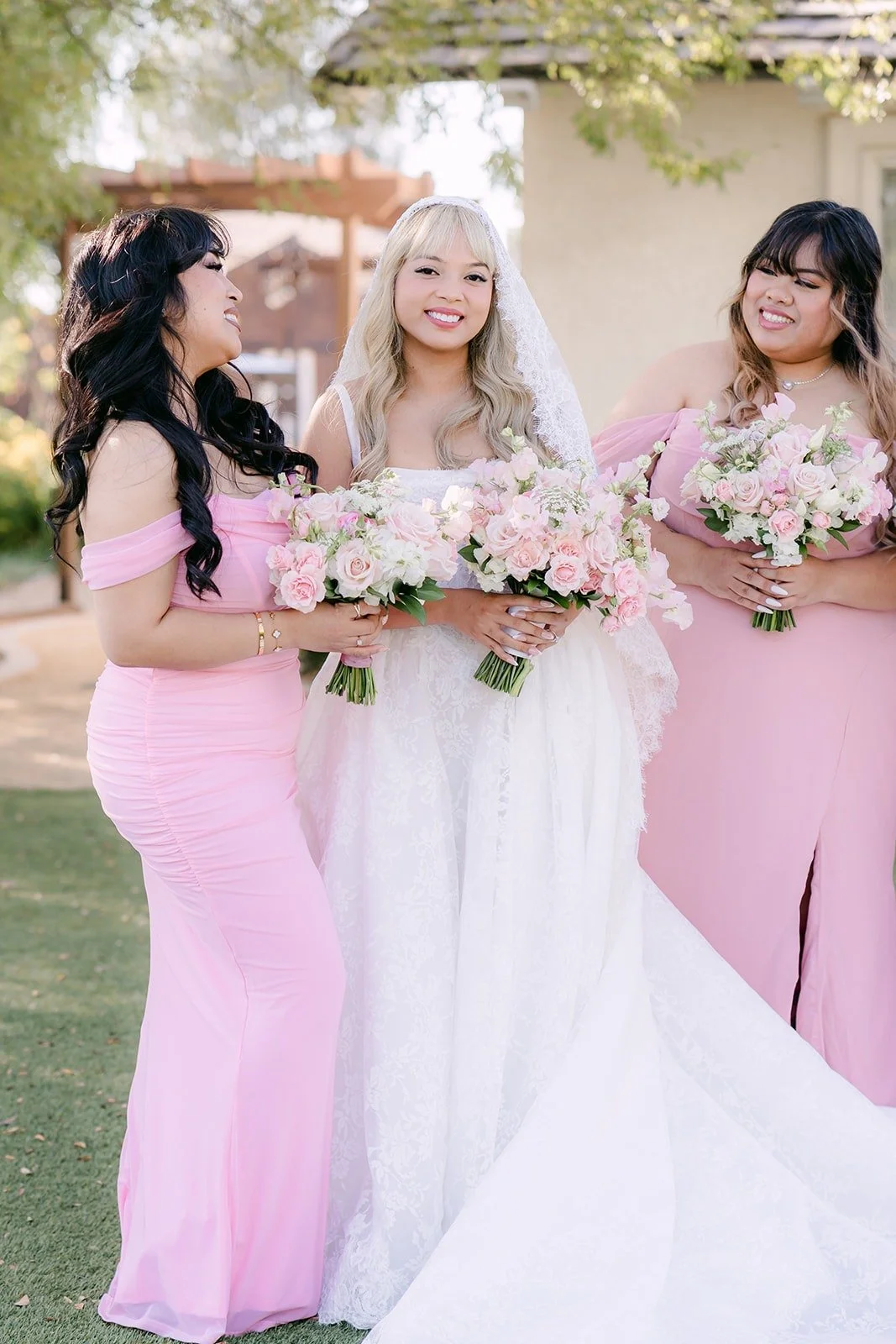 Konitha laughing with two bridesmaids
