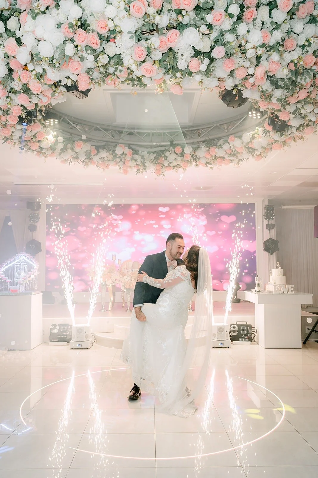 James spinning Amy as fog rolls across the dance floor