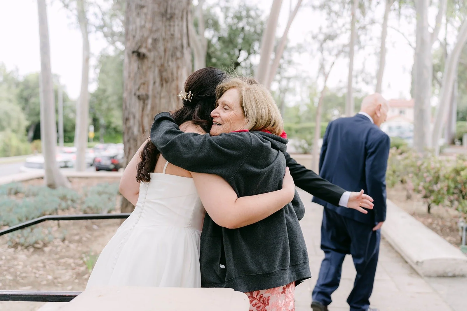 Saira hugging a guest after the ceremony, photographed by One and Only Production