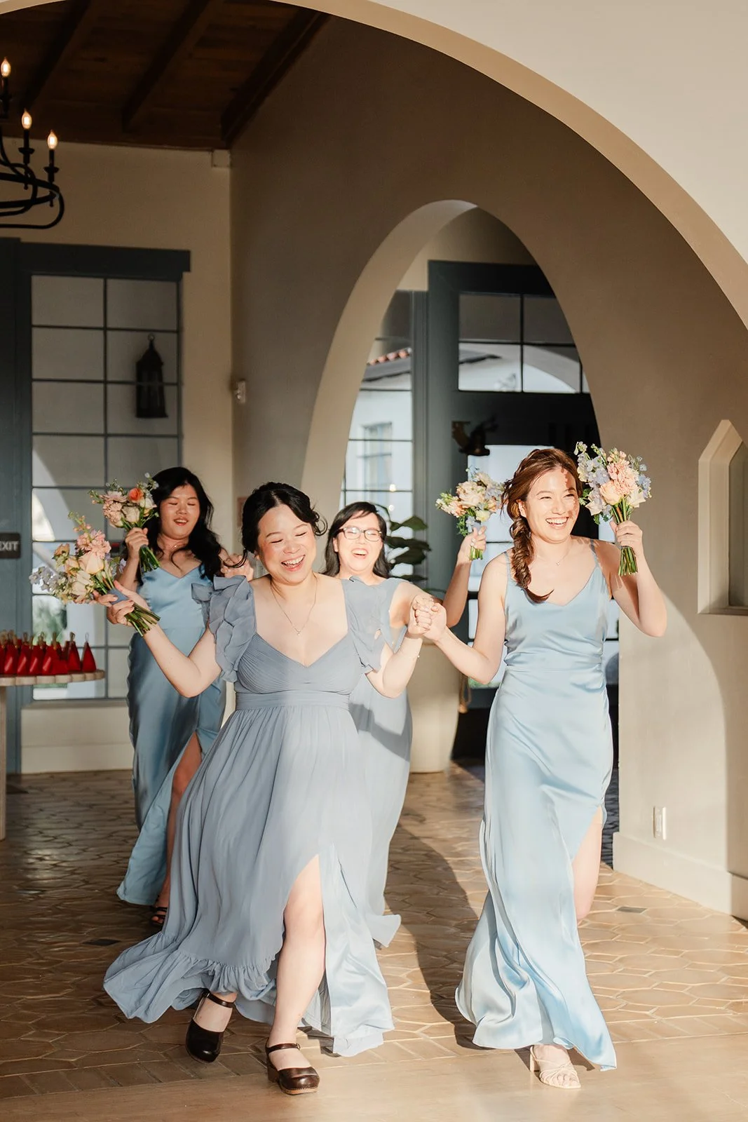Bridesmaids dancing in for the grand entrance