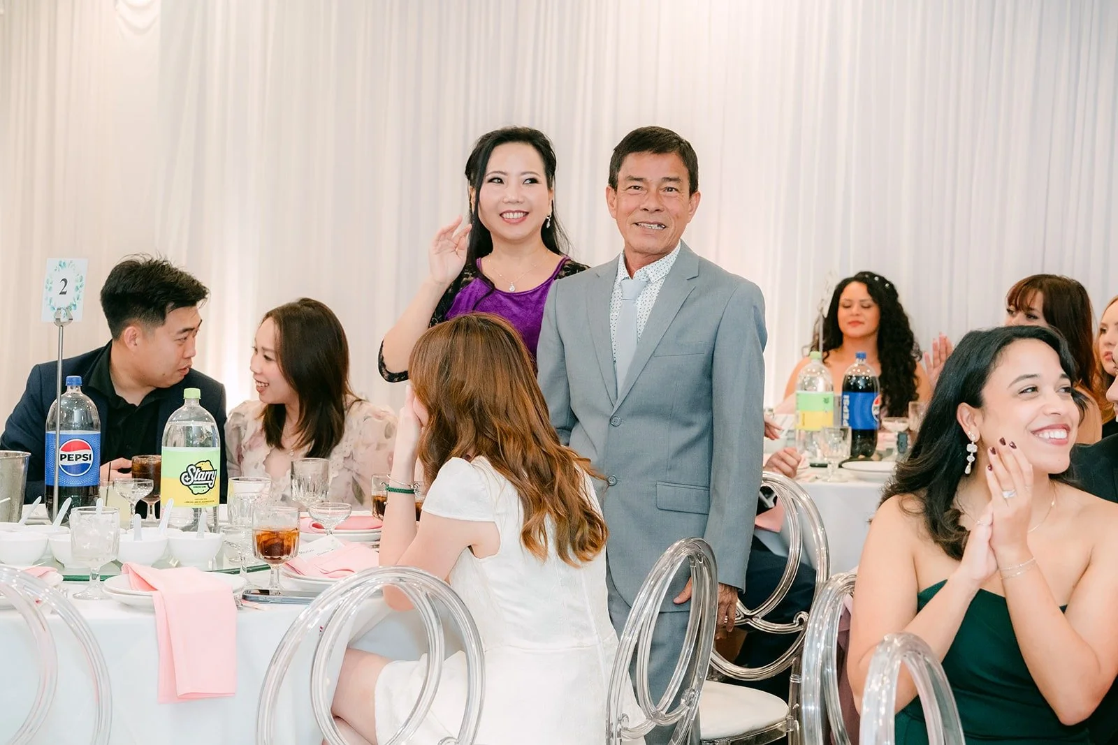 Guests smiling during a toast