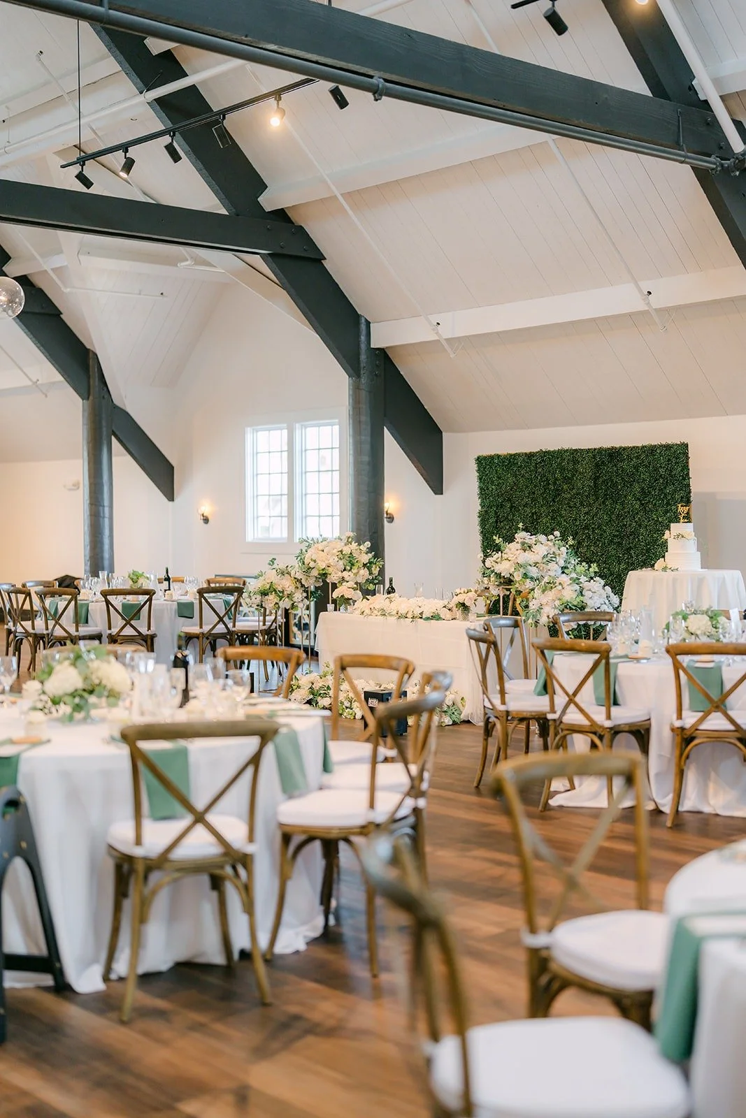 The ballroom tables beneath the black beams