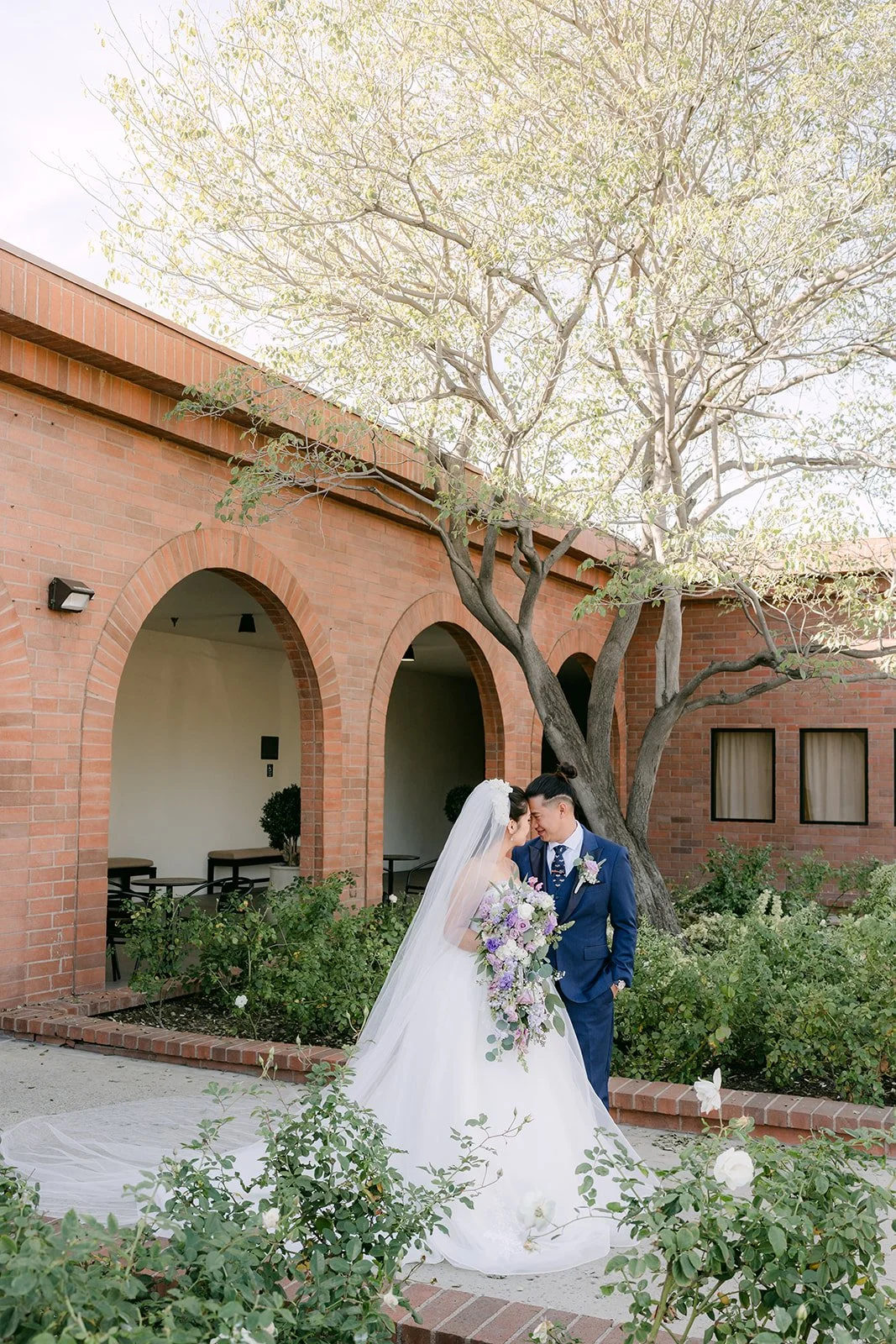 Kate and Michael walking together through the courtyard.