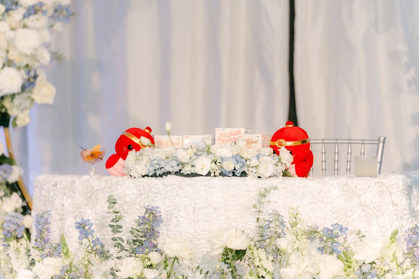 Head table set with florals at the Paracel Events reception hall