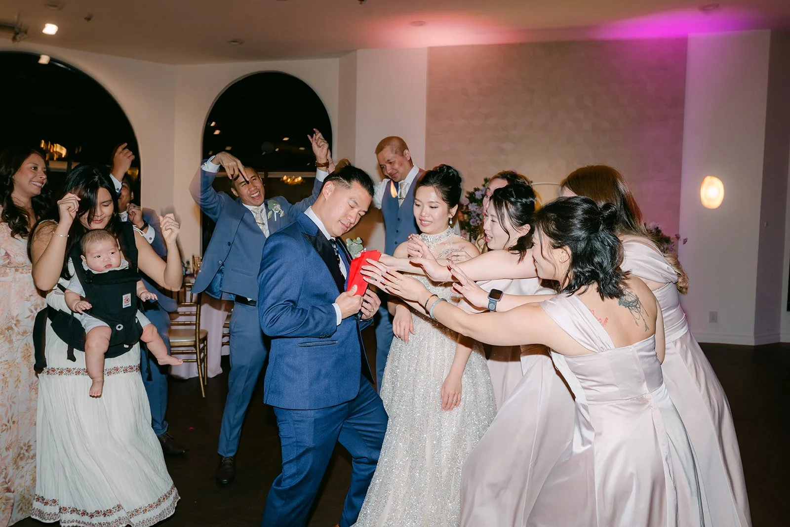 Bridesmaids and friends dancing at the reception.