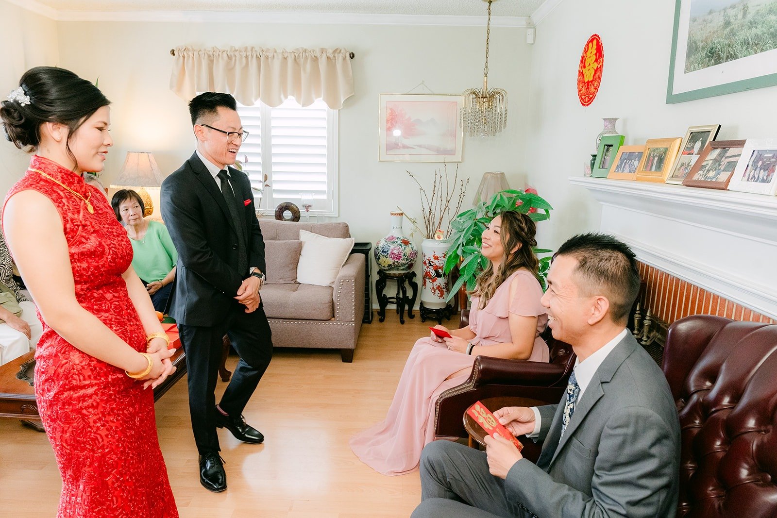 Xuemin and Alex serving tea to relatives in the living room