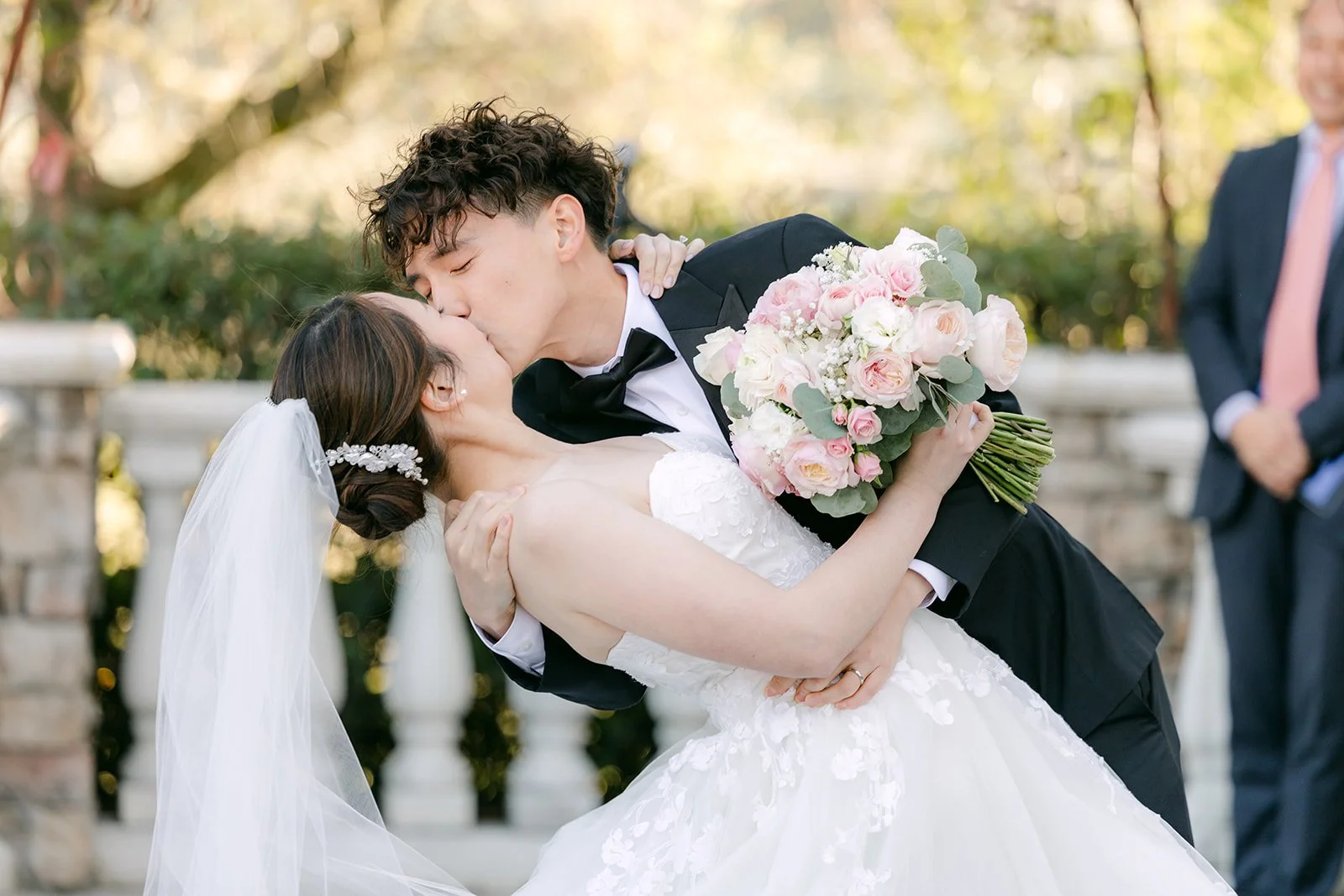 First kiss as husband and wife under the ceremony arch