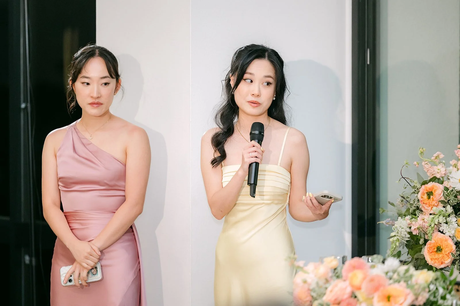 Two bridesmaids sharing a toast