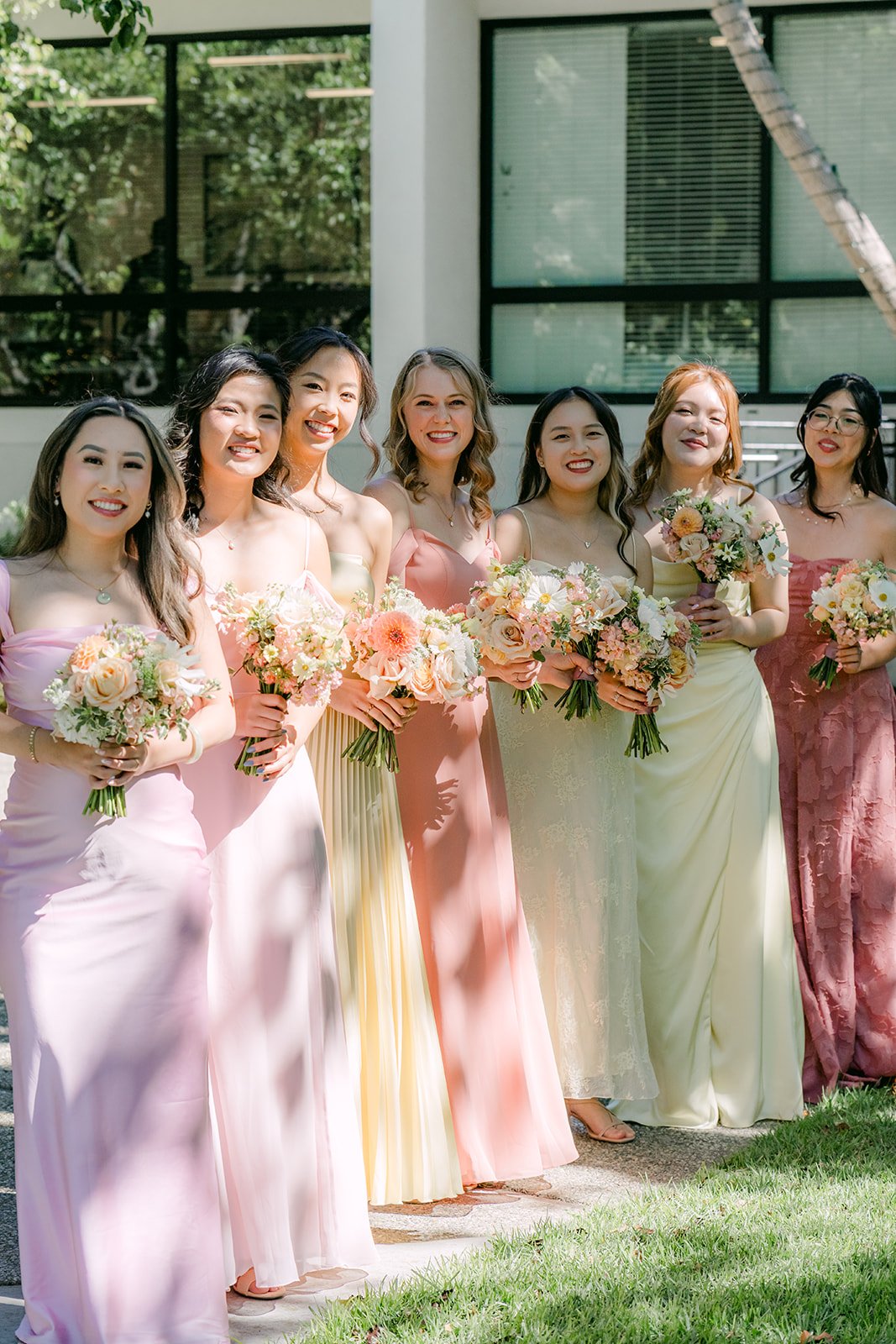 Clarissa with her bridesmaids under the oak trees