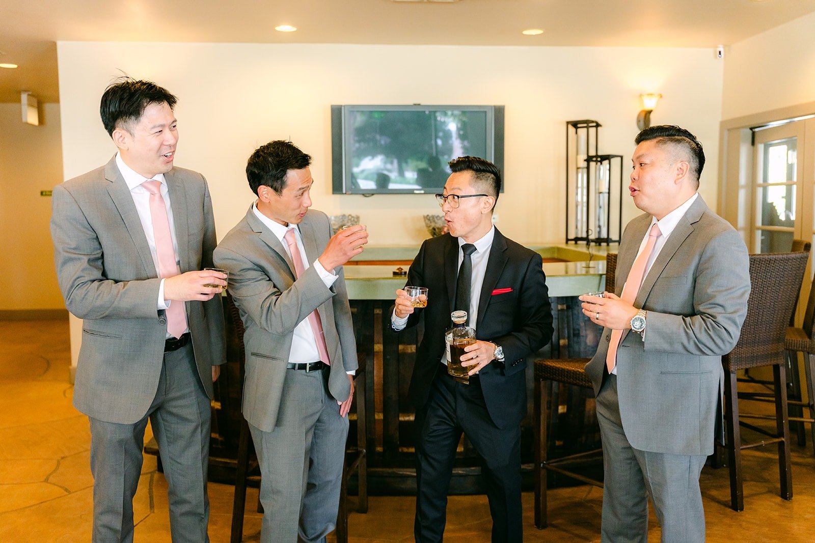 Alex and the groomsmen sharing a toast