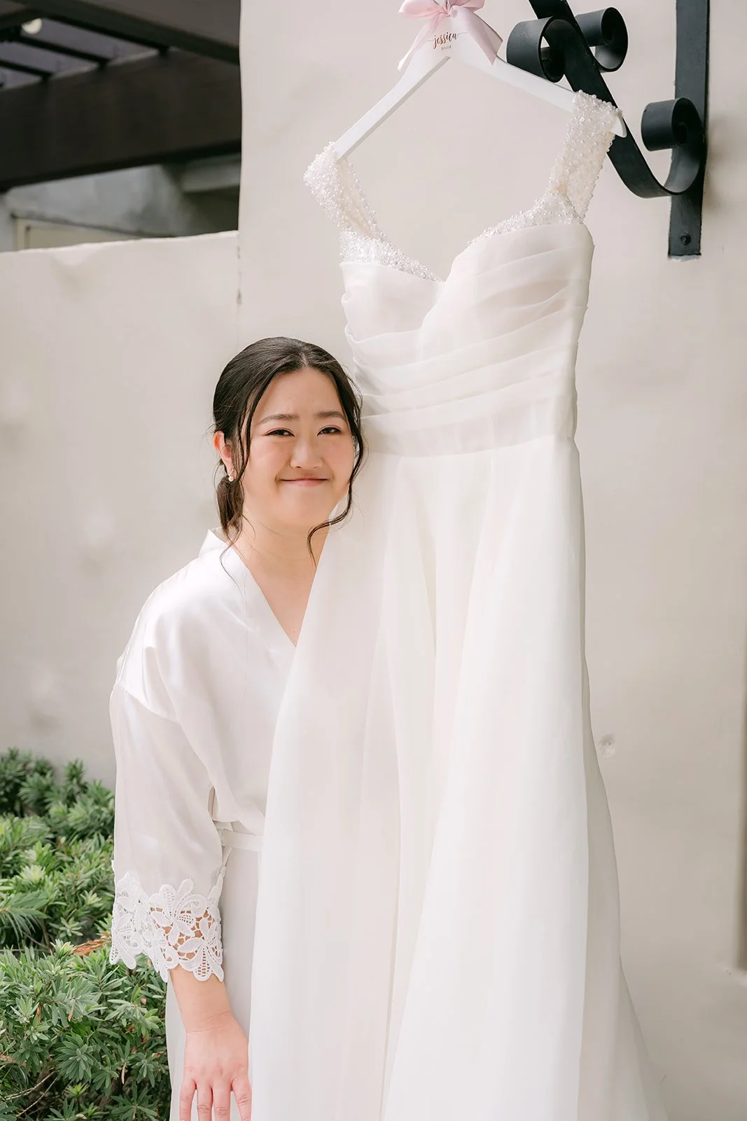 Jessica smiling in her bridal robe
