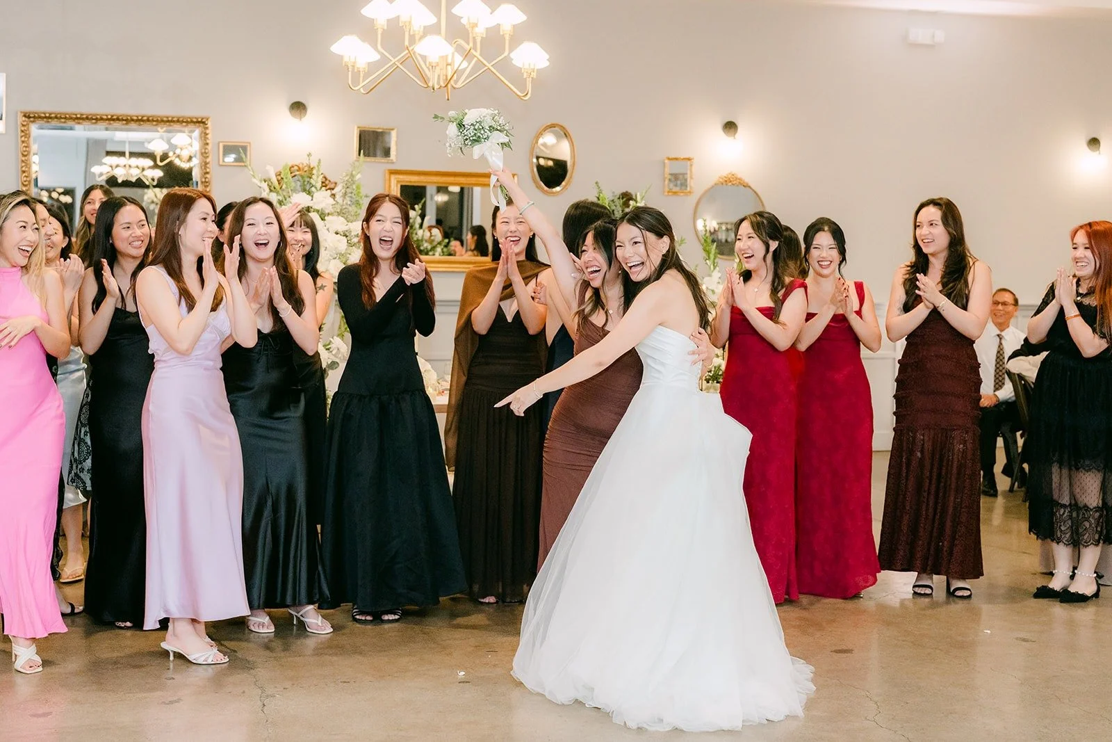 Jadee tossing her bouquet over her shoulder