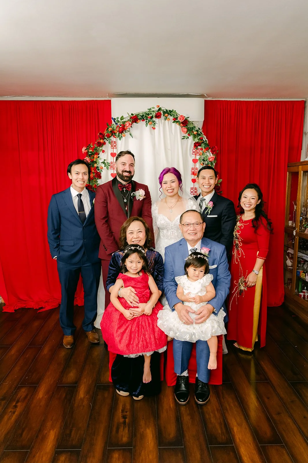 Vanessa's family with the nieces in red and white.