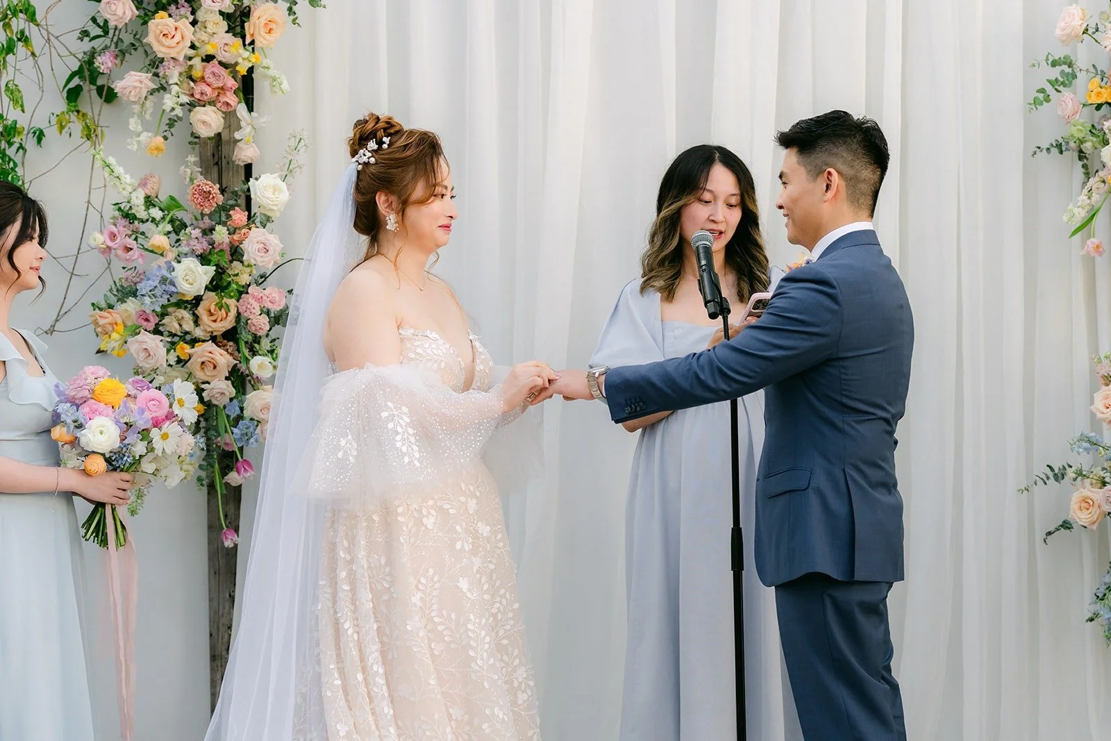 Joanna and Jerrick exchanging rings at the altar