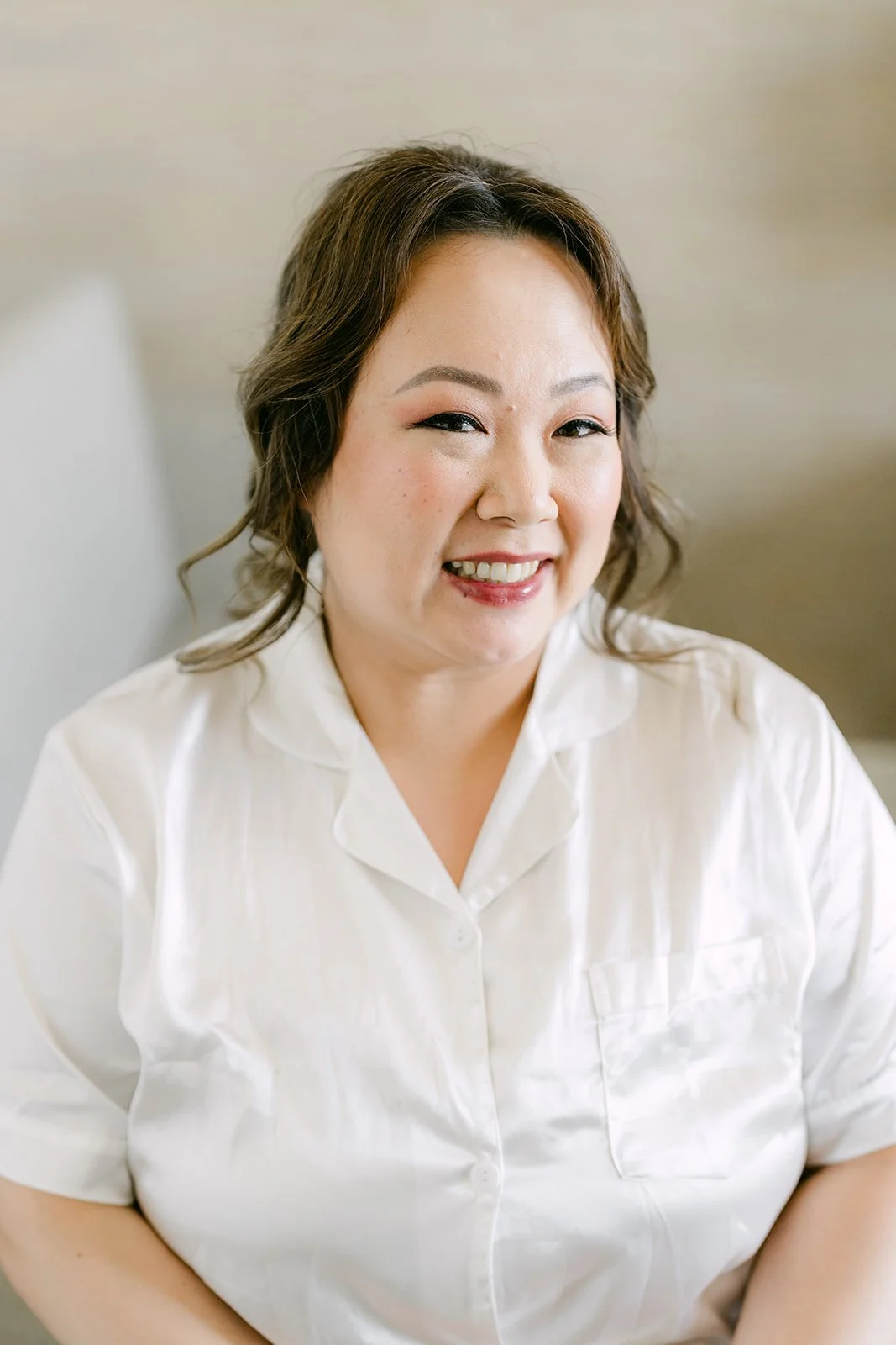 Mai smiling after hair and makeup.