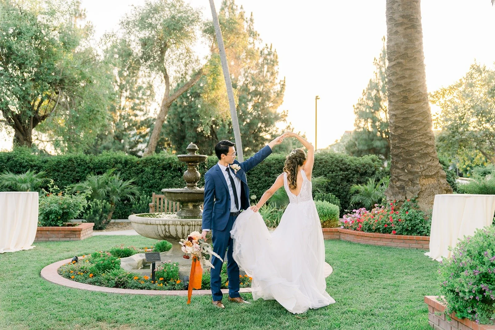 Ariel and Alex by the garden fountain