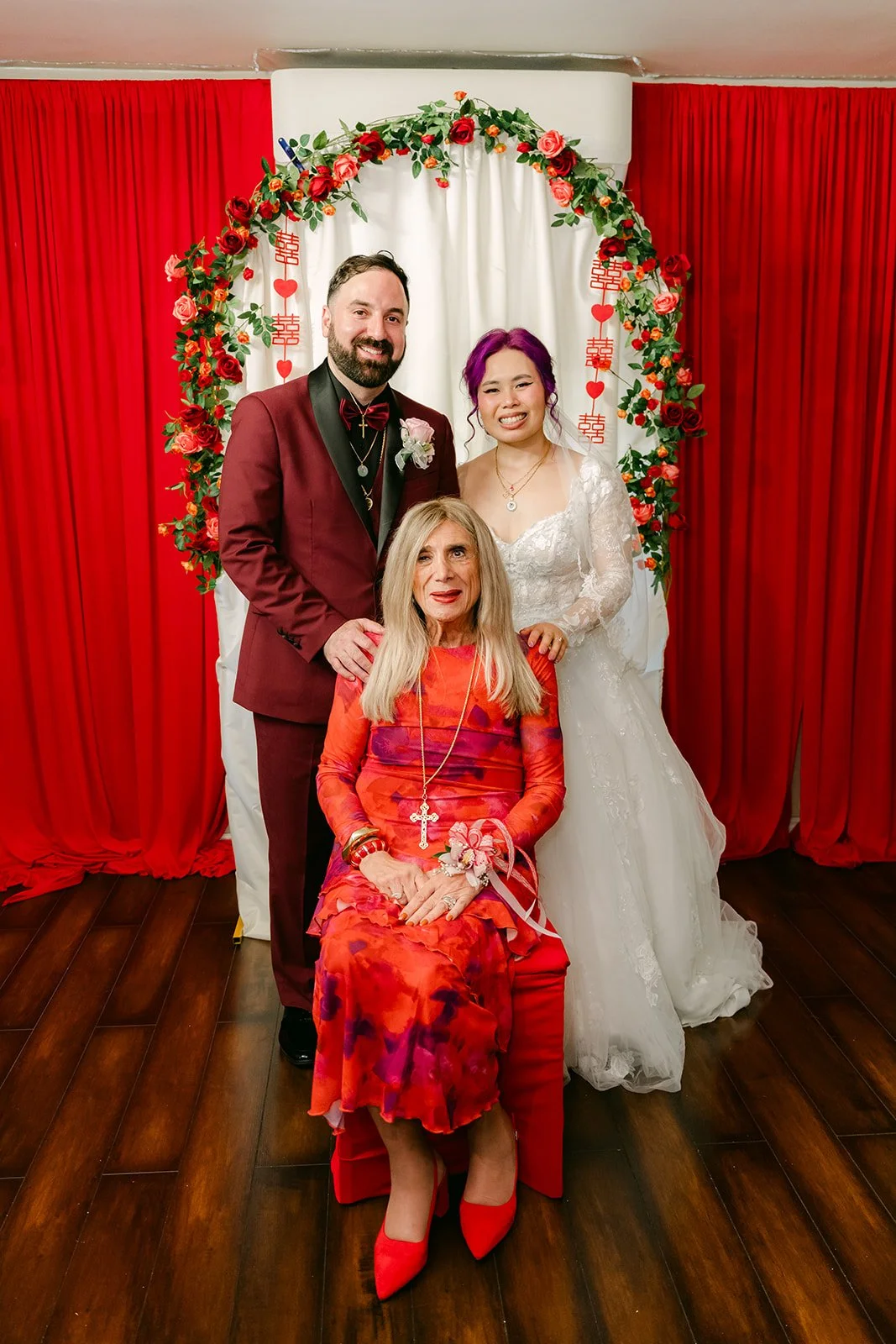Vanessa and Ryan with a relative in red.