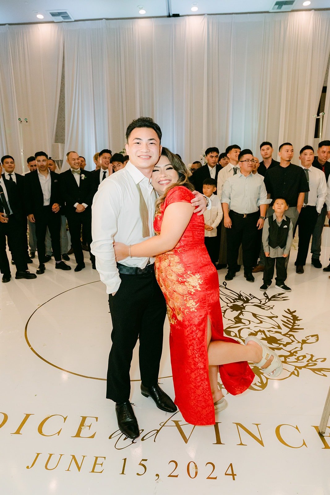 Vincent and Candice on the monogrammed dance floor for the garter toss