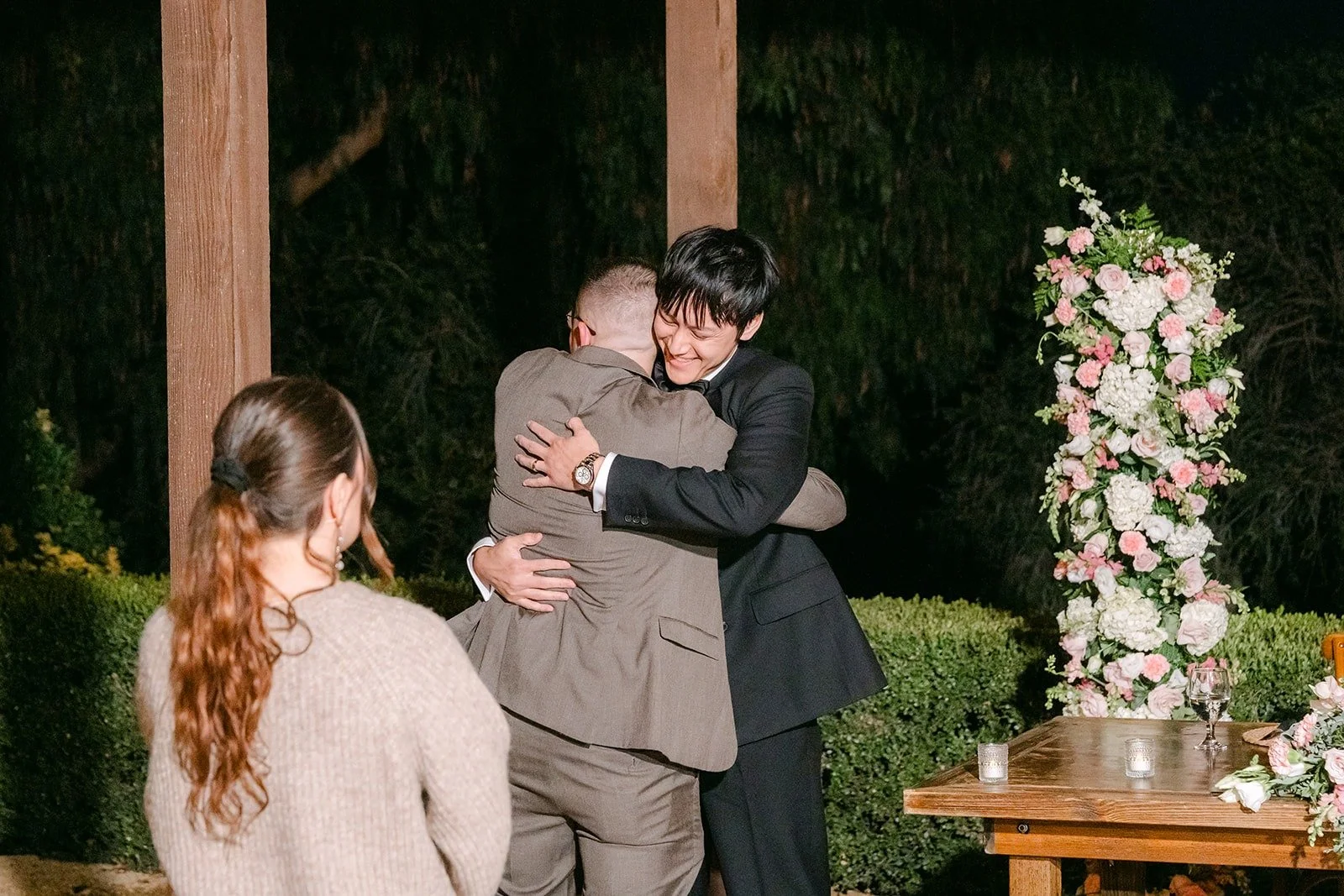 Job hugging a guest at the sweetheart table