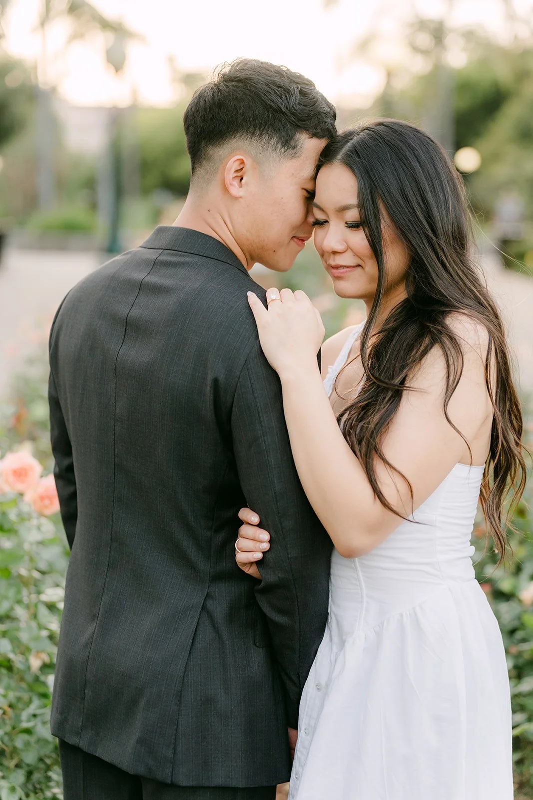 Jadee rests her hand on Richard's chest as they lean in close.