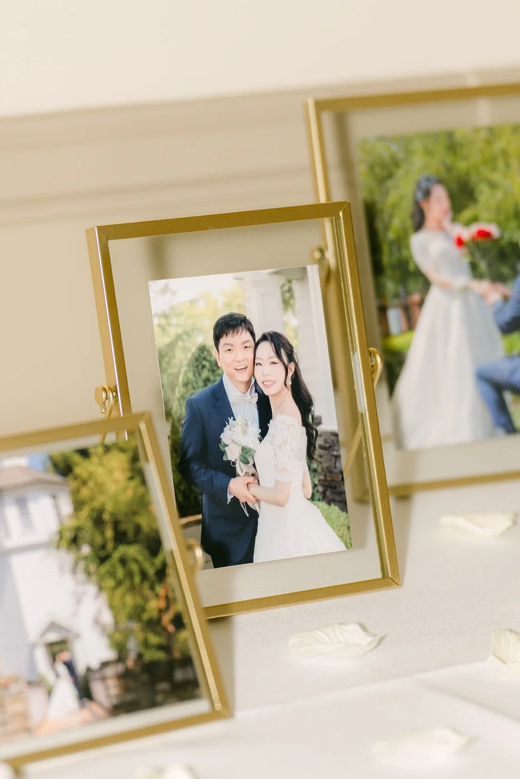 Framed photos of Jeannie and Eunsang on the welcome table