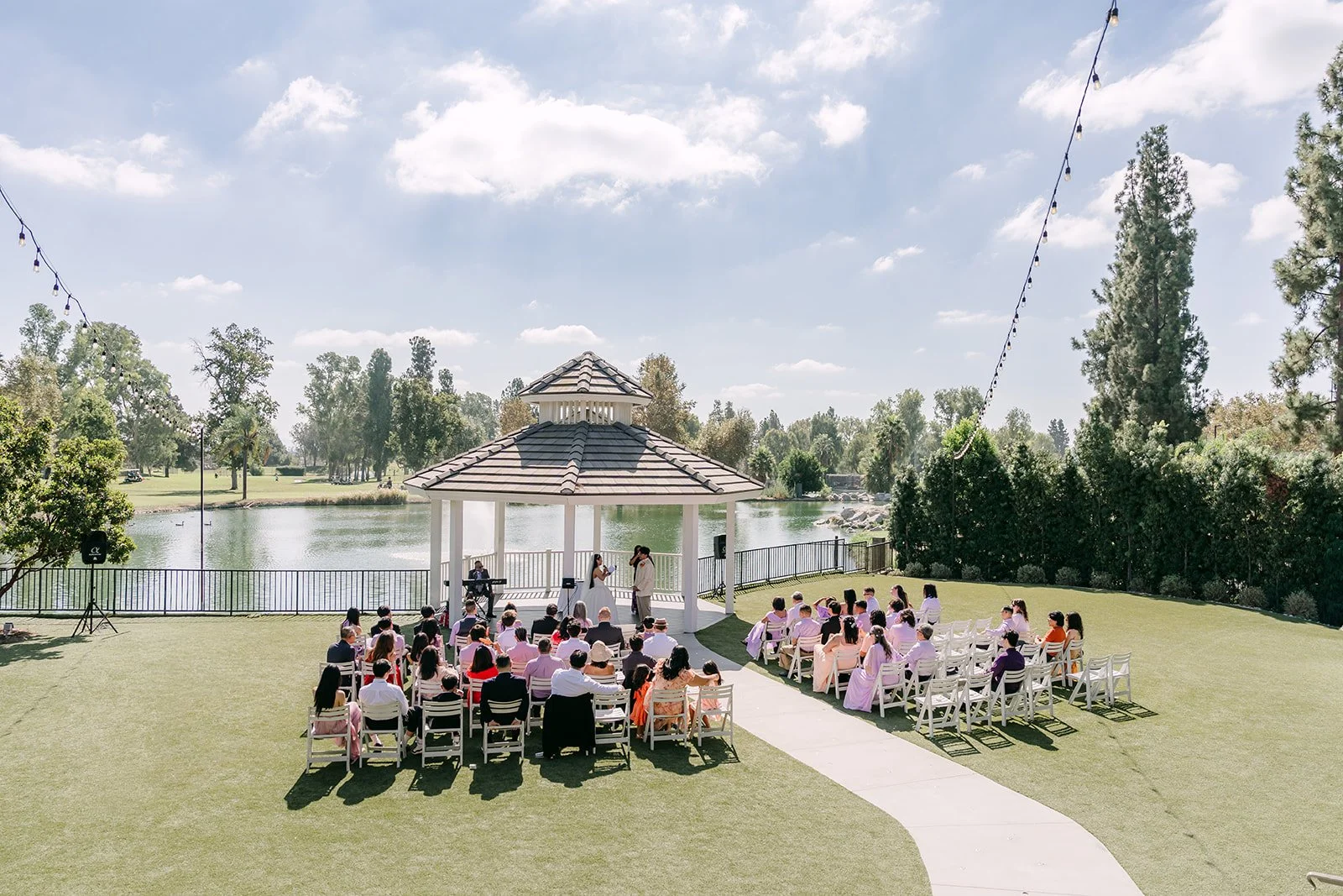 A wide view of the gazebo ceremony at Almansor Court