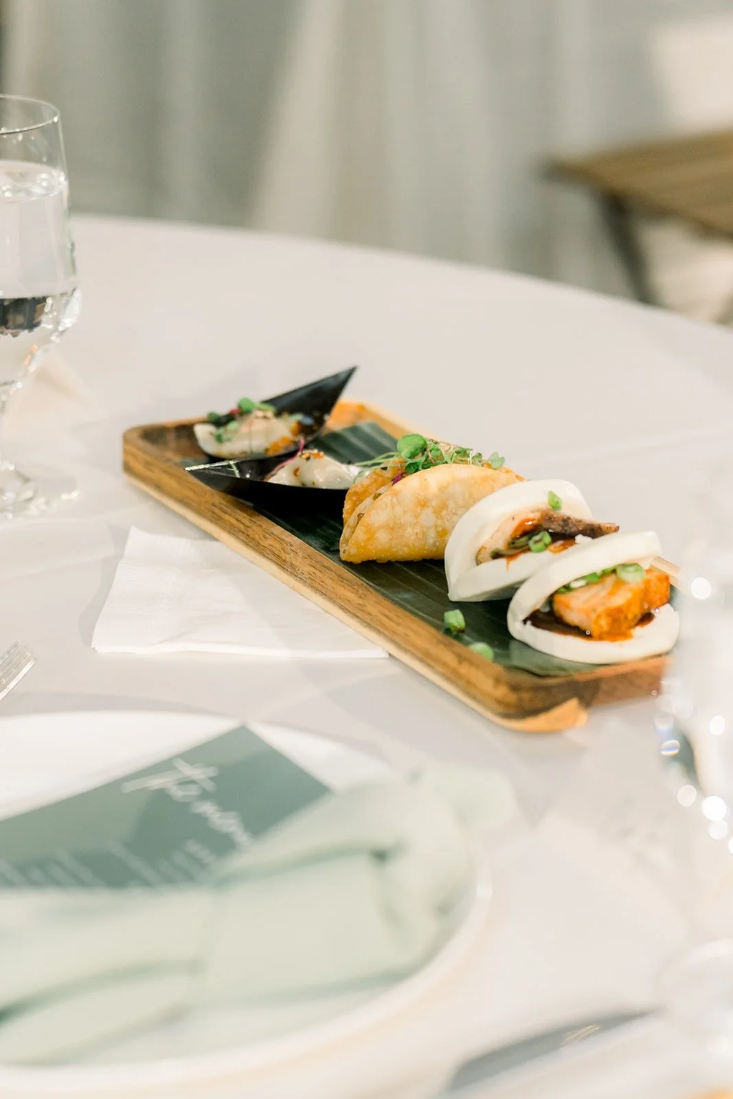 Bao buns from the dinner service on a wooden board
