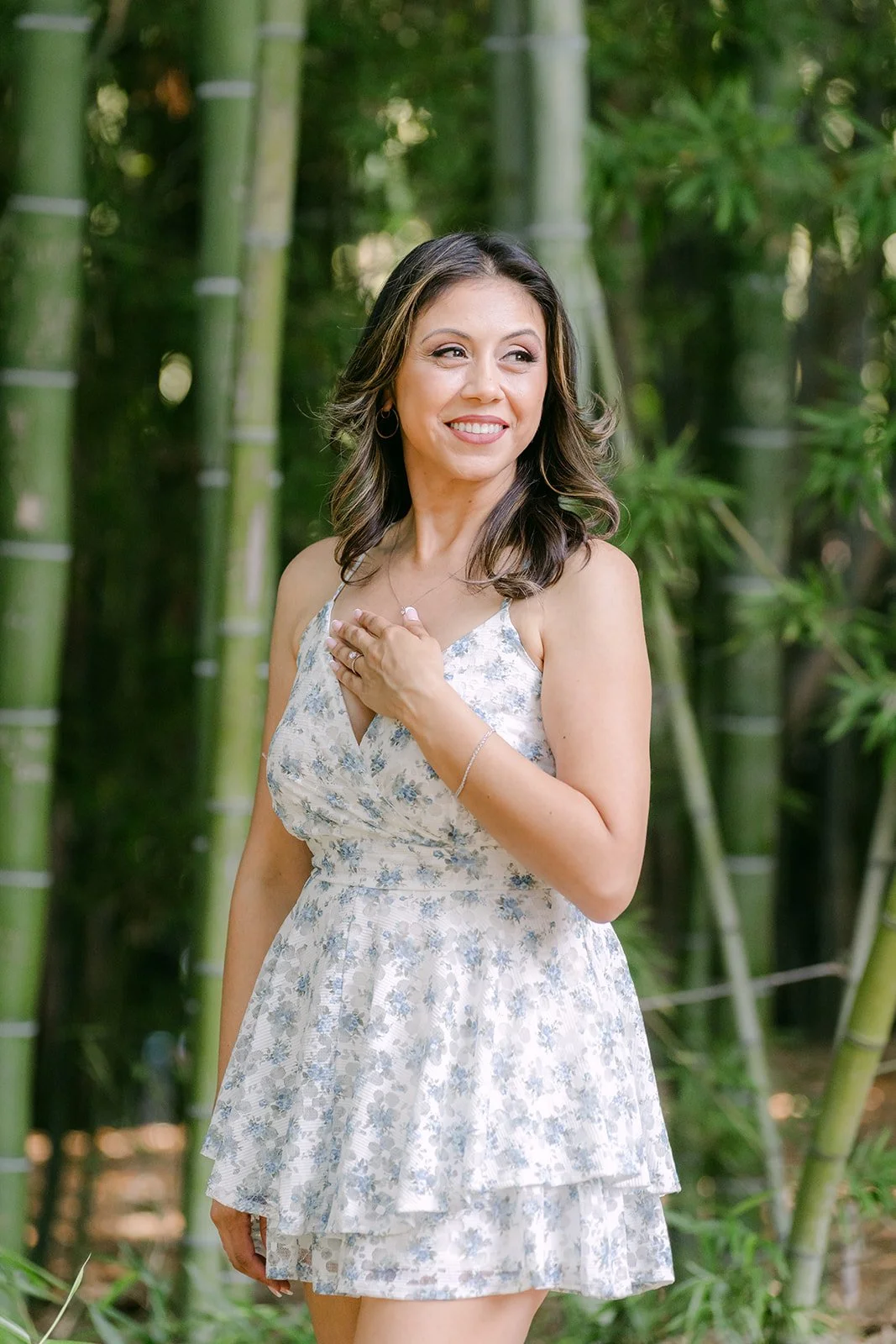 Portrait of Francesca in a floral dress in the bamboo forest.