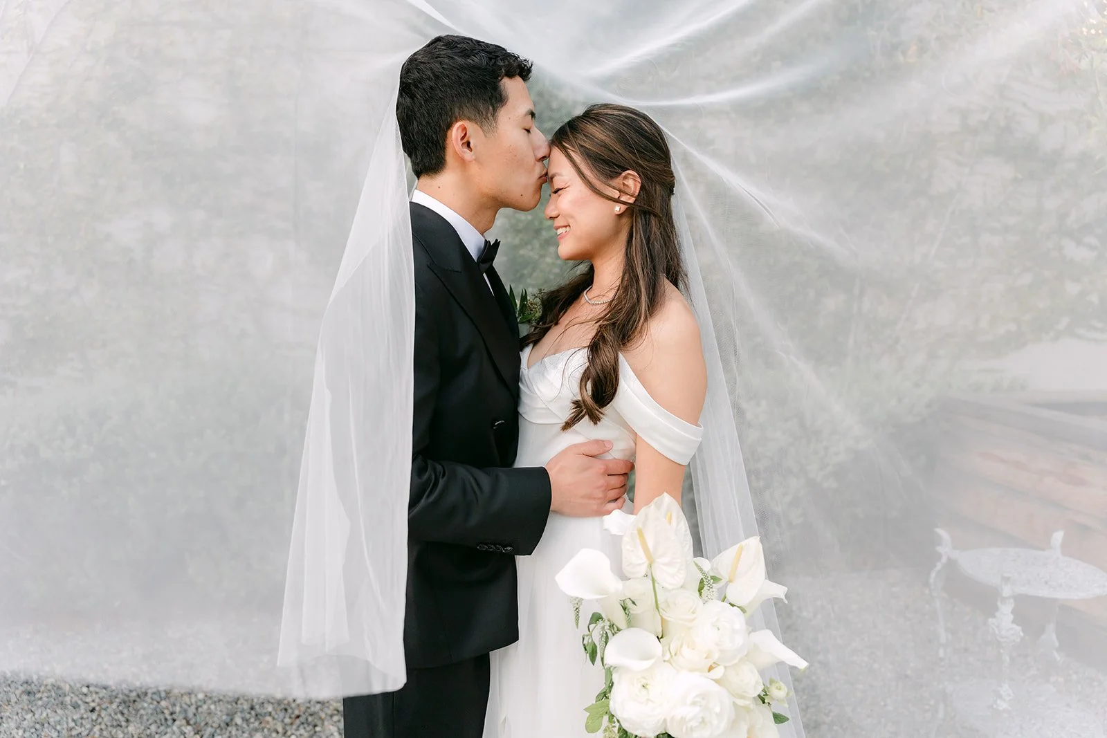 Richard kissing Jadee's forehead under the veil