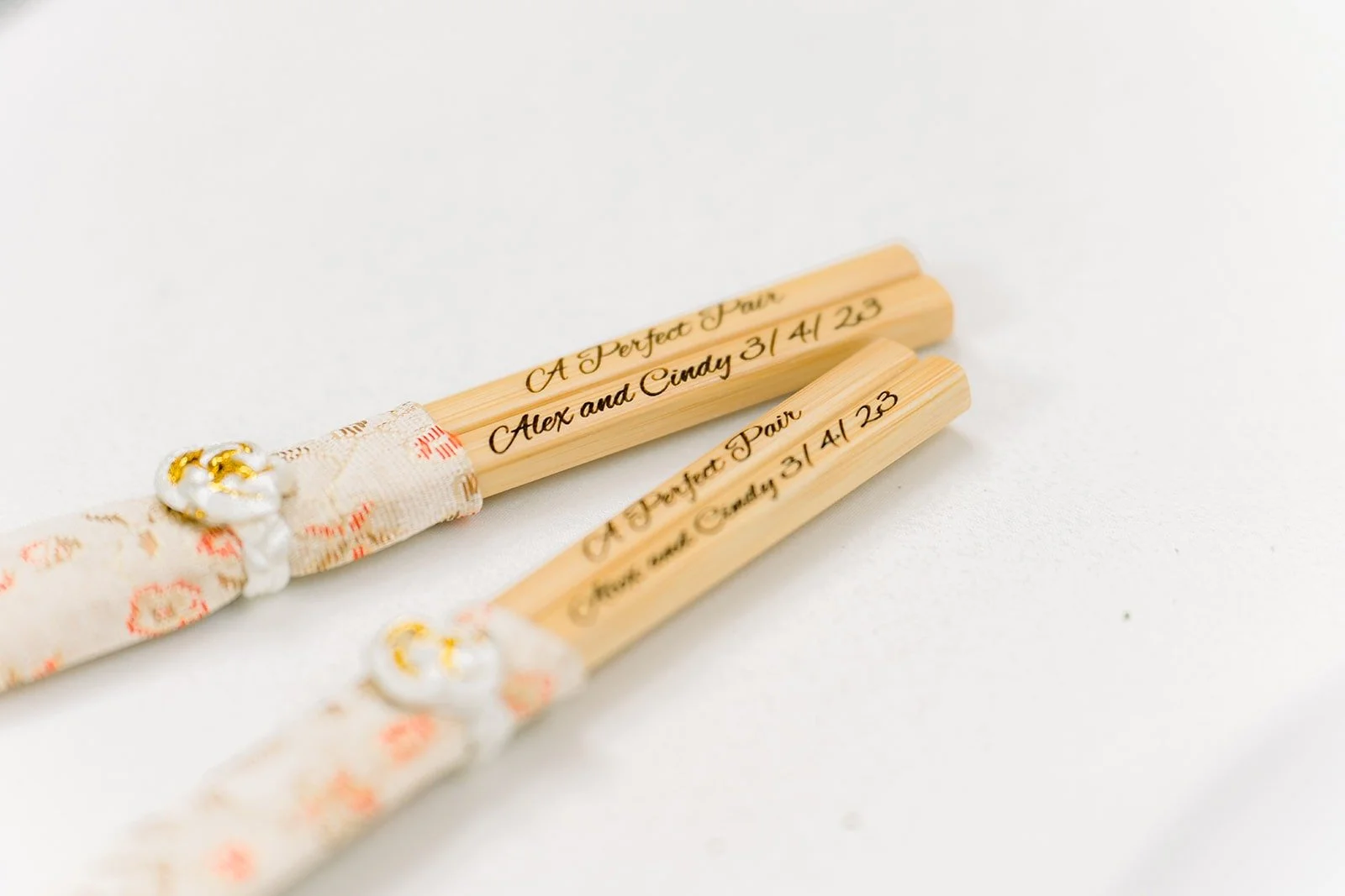 Gold engraved chopsticks set out for guests