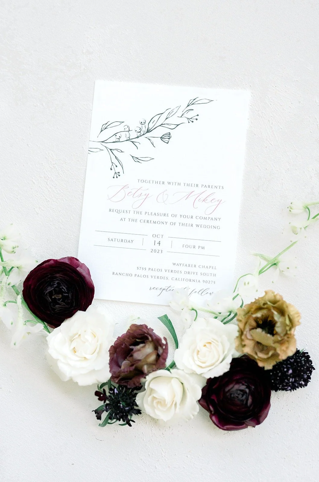 The invitation suite with burgundy, cream and blush roses, photographed by One and Only Production