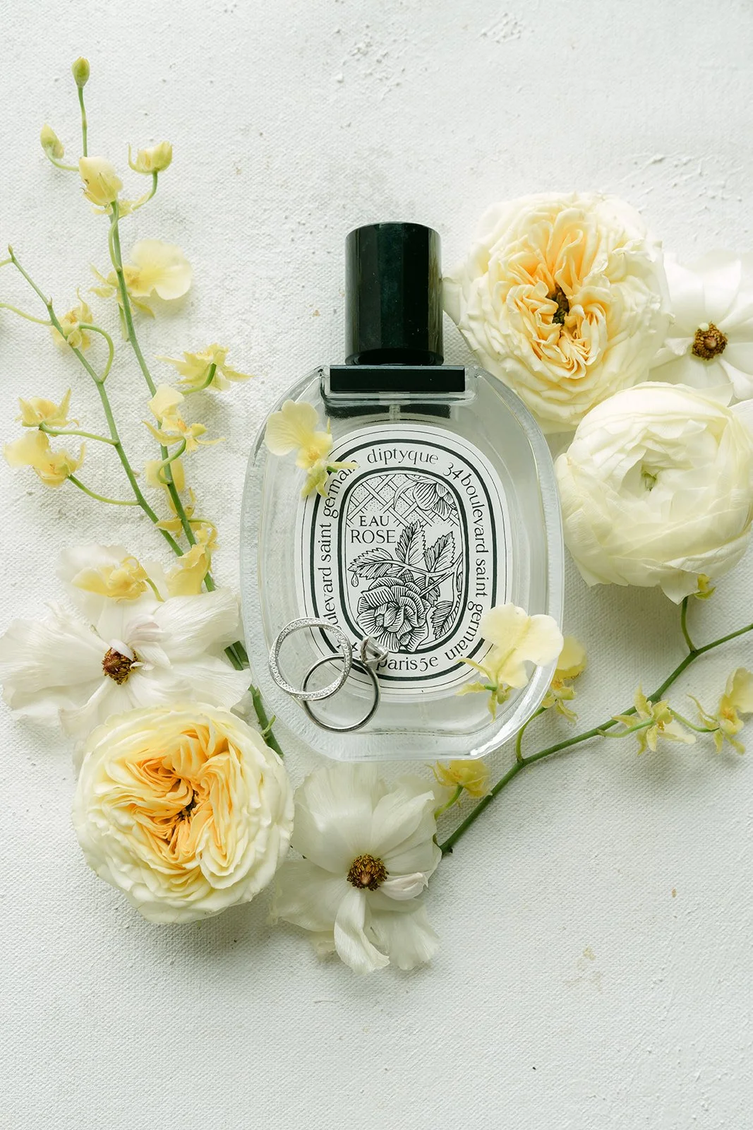 Jenny's perfume styled with butter yellow roses and white blooms.