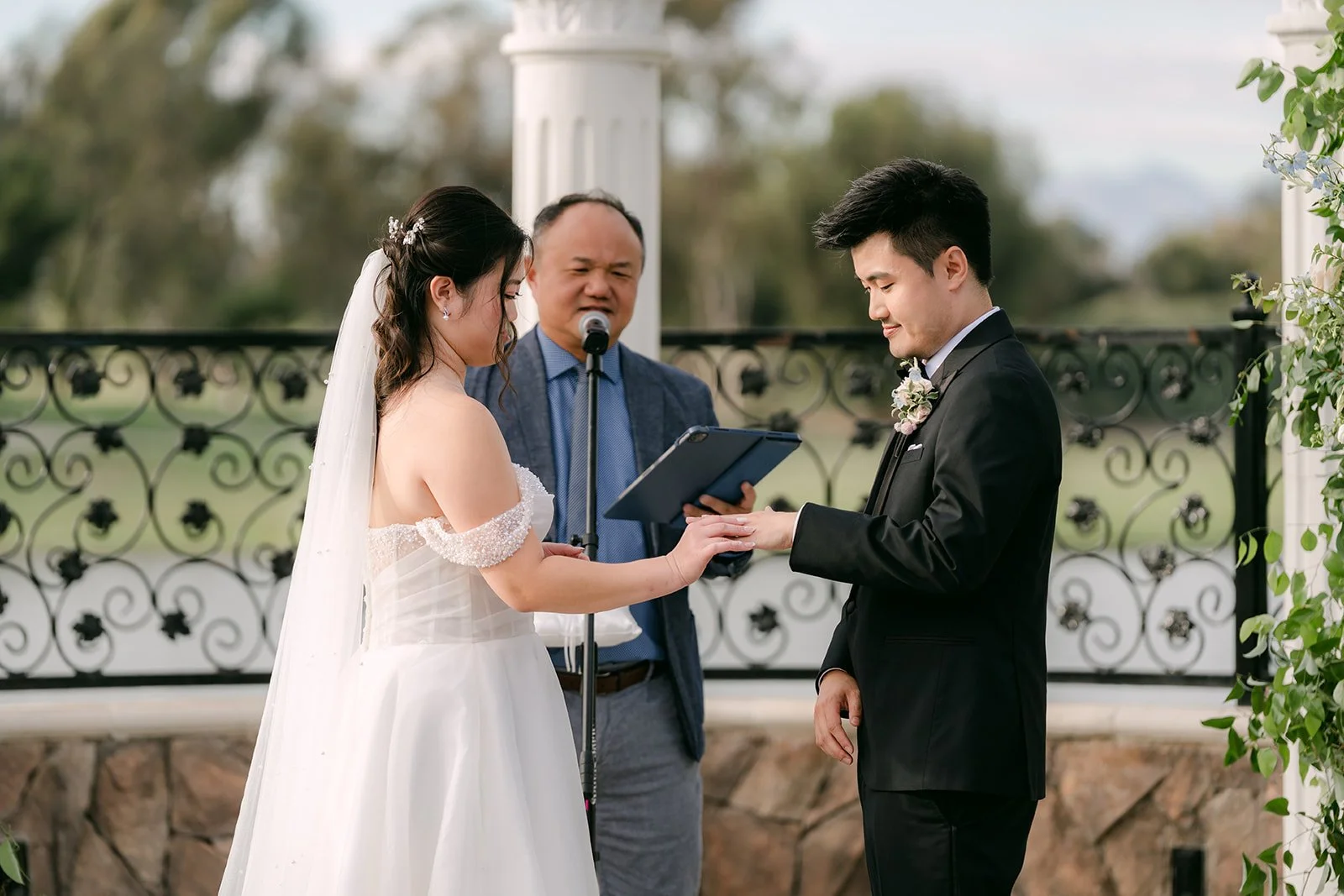 Jessica and Kenny laughing with the officiant