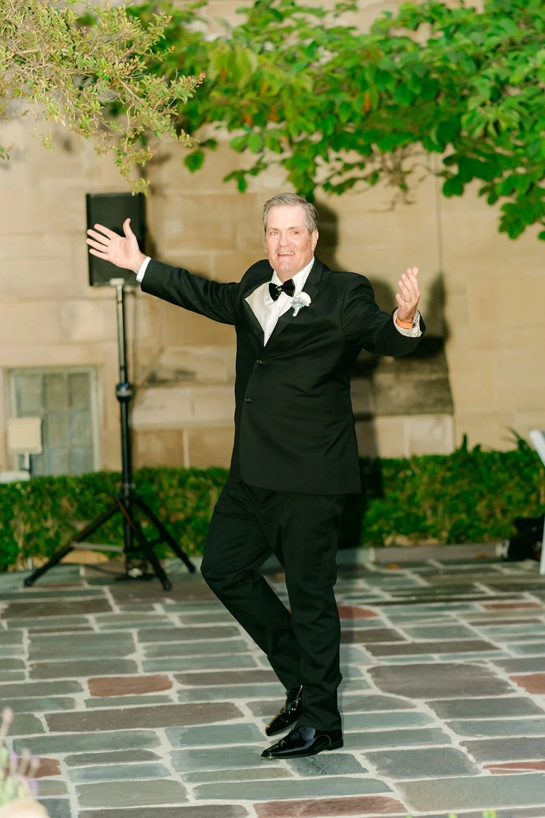 A guest getting the crowd going before the parent dances