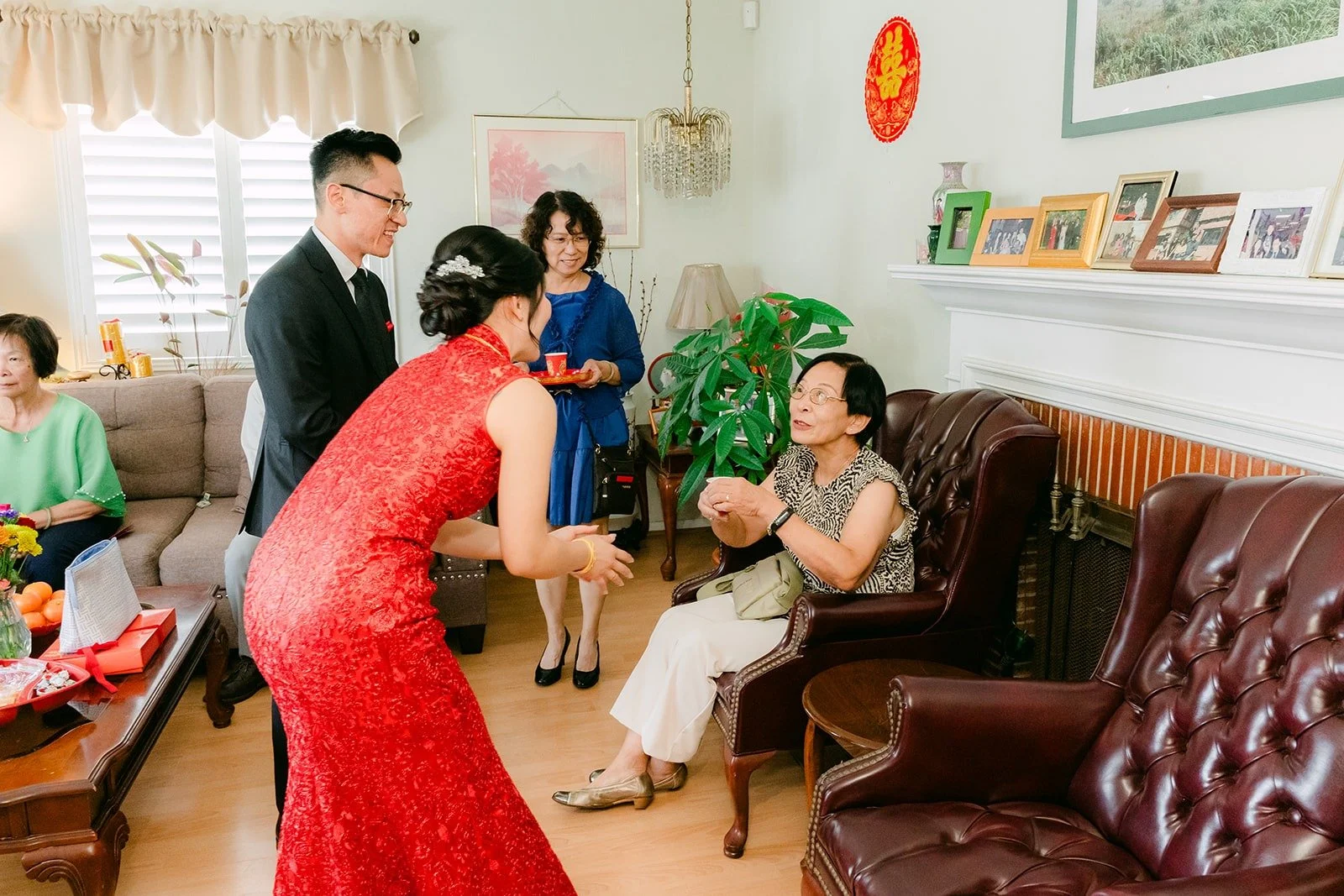 Family members watching the tea ceremony from the living room