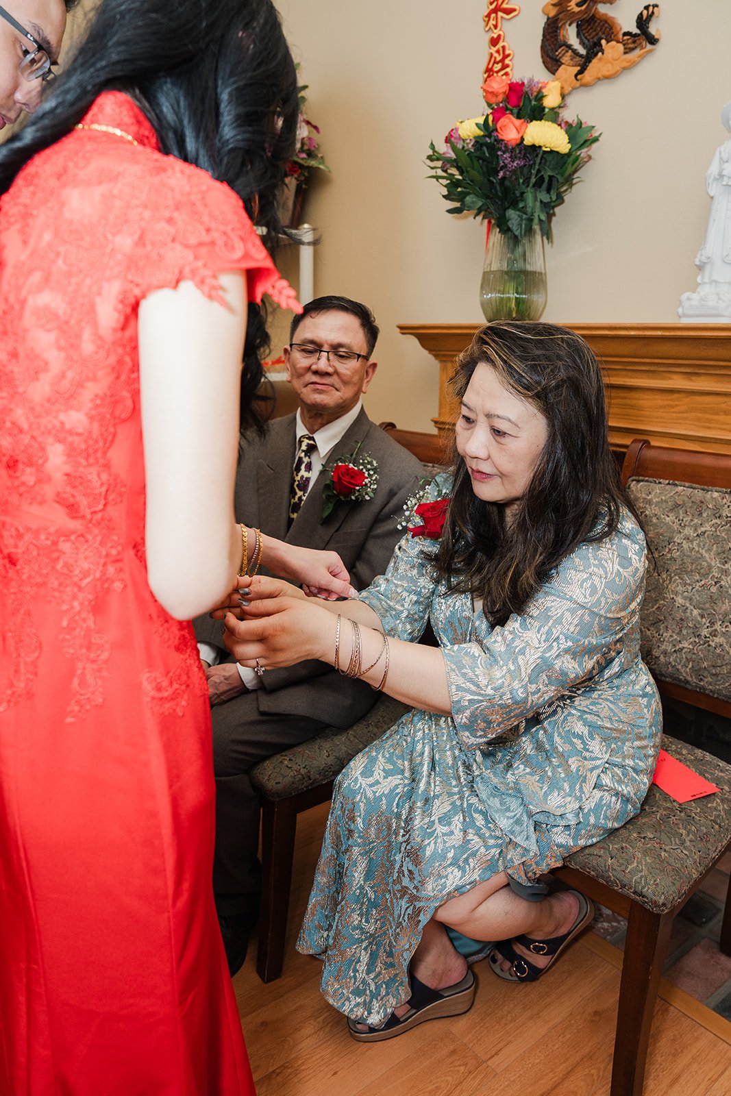 The couple bowing to an elder.
