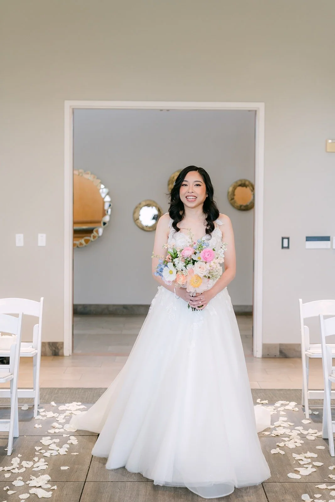 Natalie walking in for the first look holding her bouquet