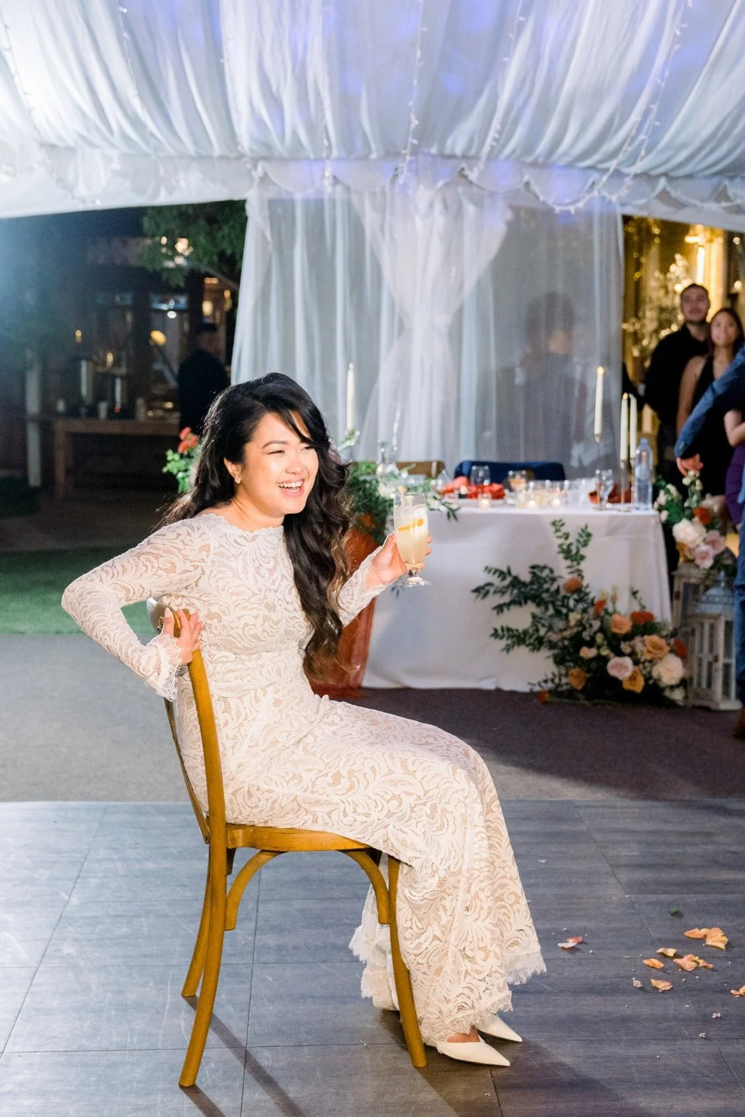 Hannah seated for the garter toss