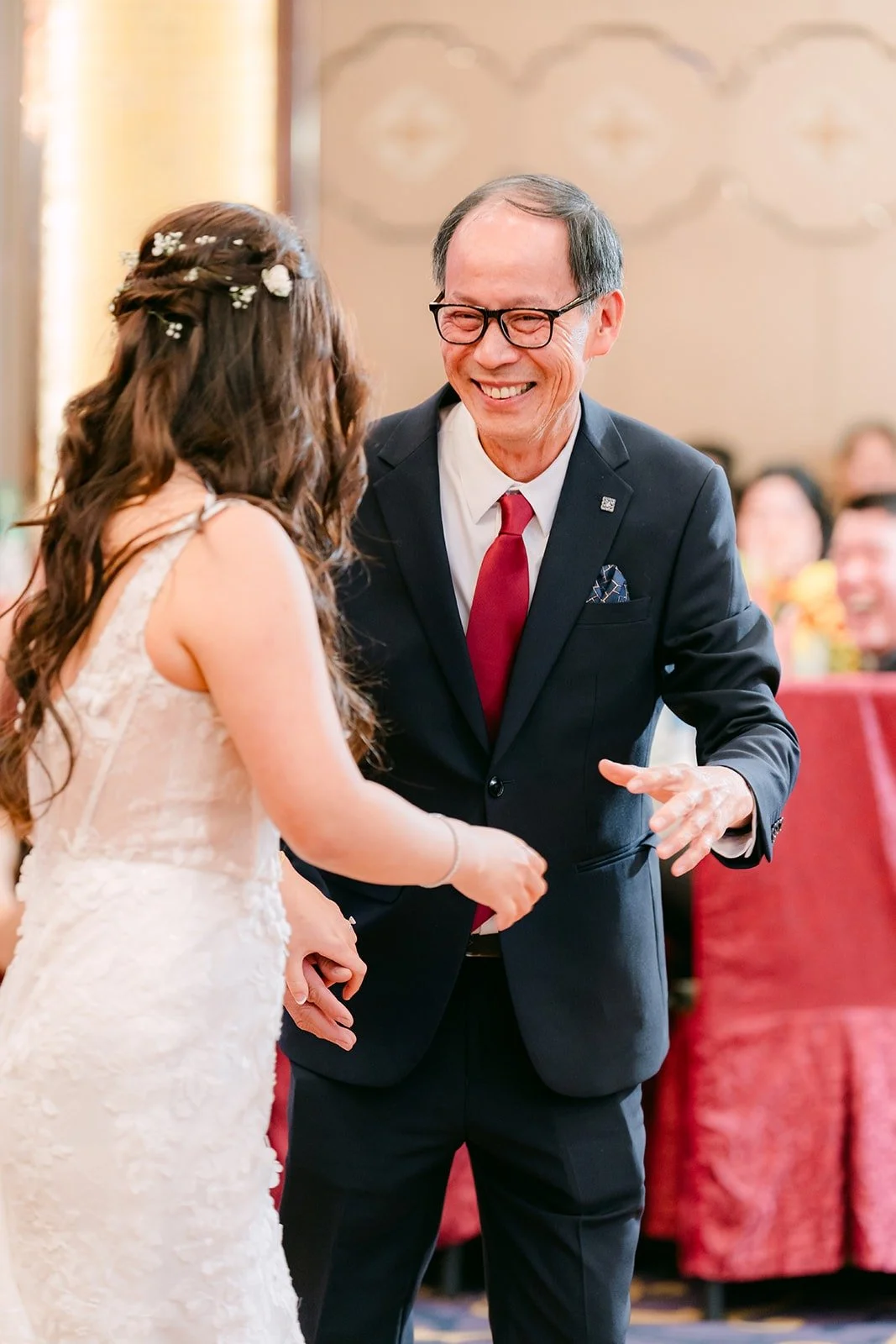 Shayna and a parent laughing on the dance floor, photographed by One and Only Production