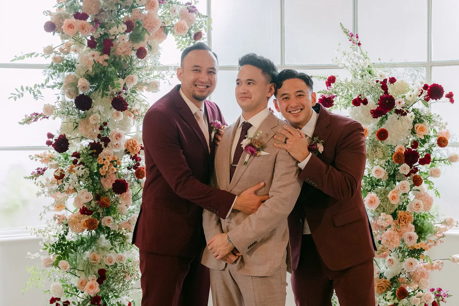 Michael hugging his brothers and laughing.