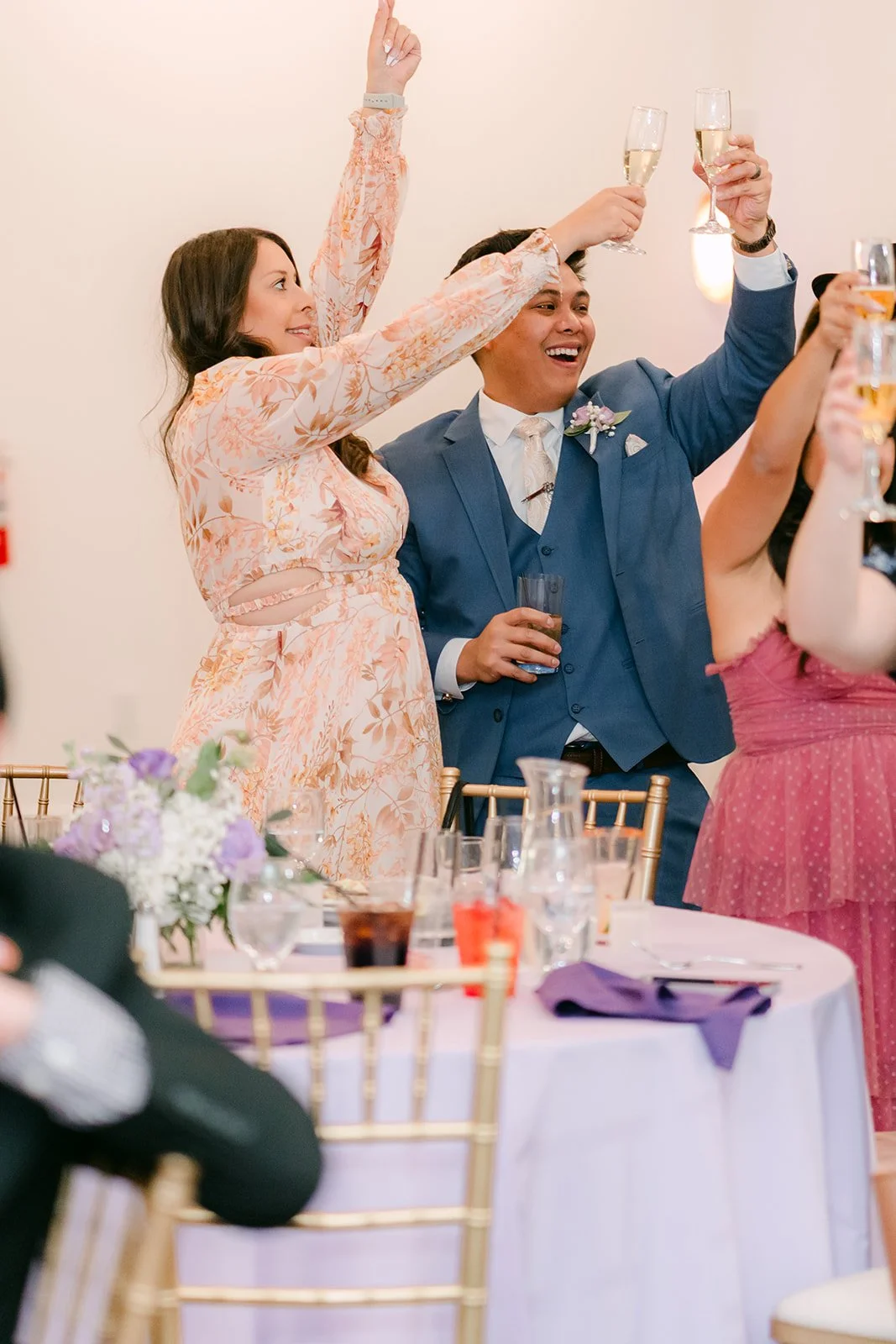 Kate and Michael cheering with guests during the toasts.