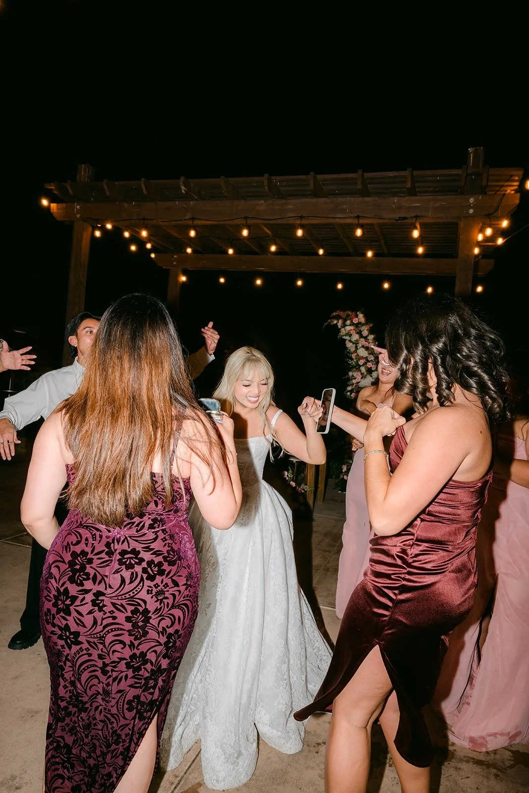 Bridesmaids dancing with Konitha on the patio