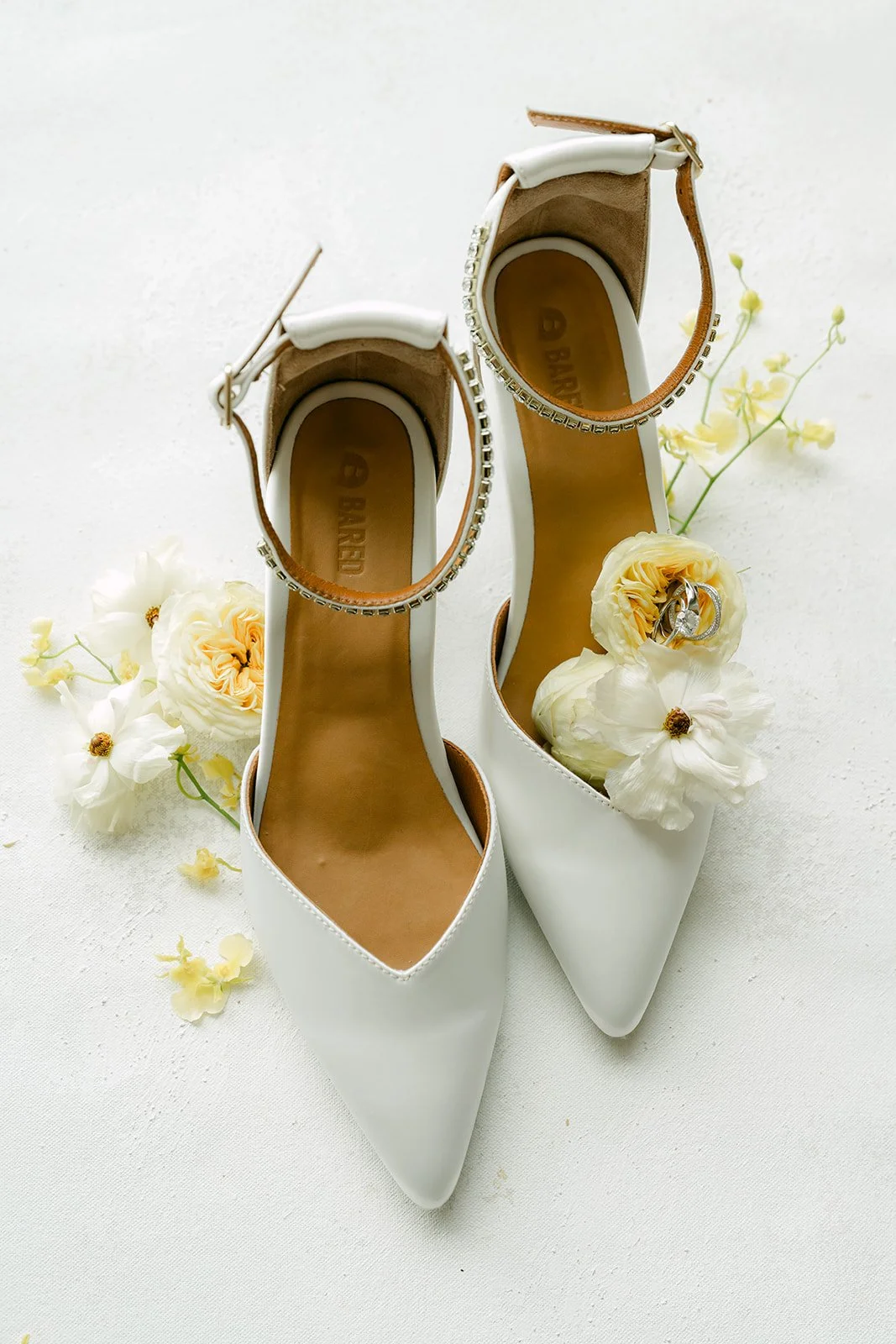 Bridal heels and florals, photographed by One and Only Production.