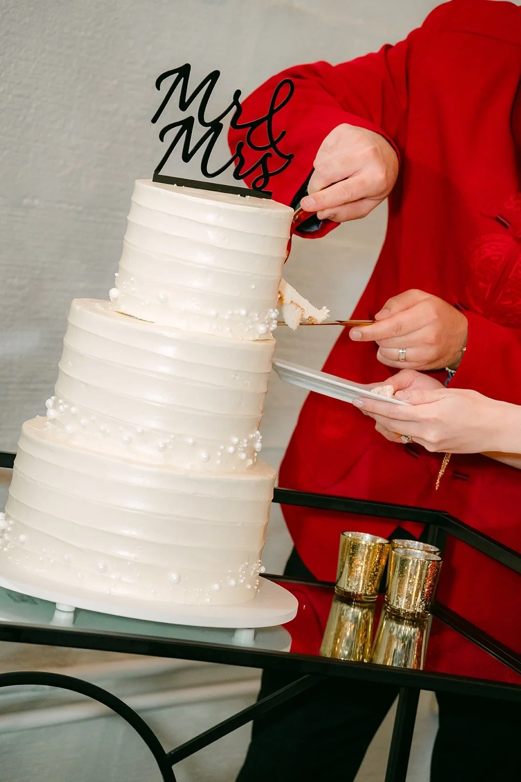 Brandon and Elisa laugh as they share the first slice, photographed by One and Only Production