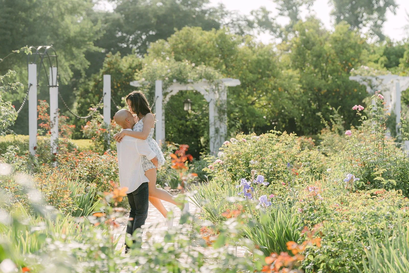 Francesca and Daniel walk through the rose garden at the LA Arboretum.