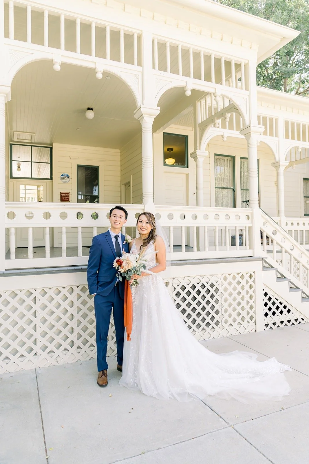 Ariel and Alex on the white lattice porch