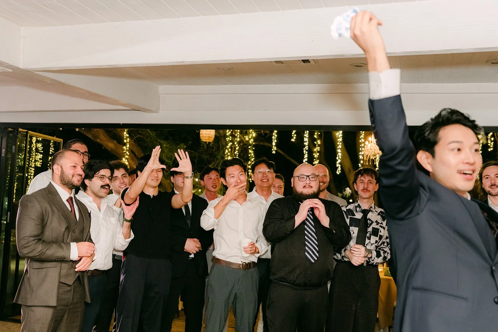Shogo celebrating after the garter toss