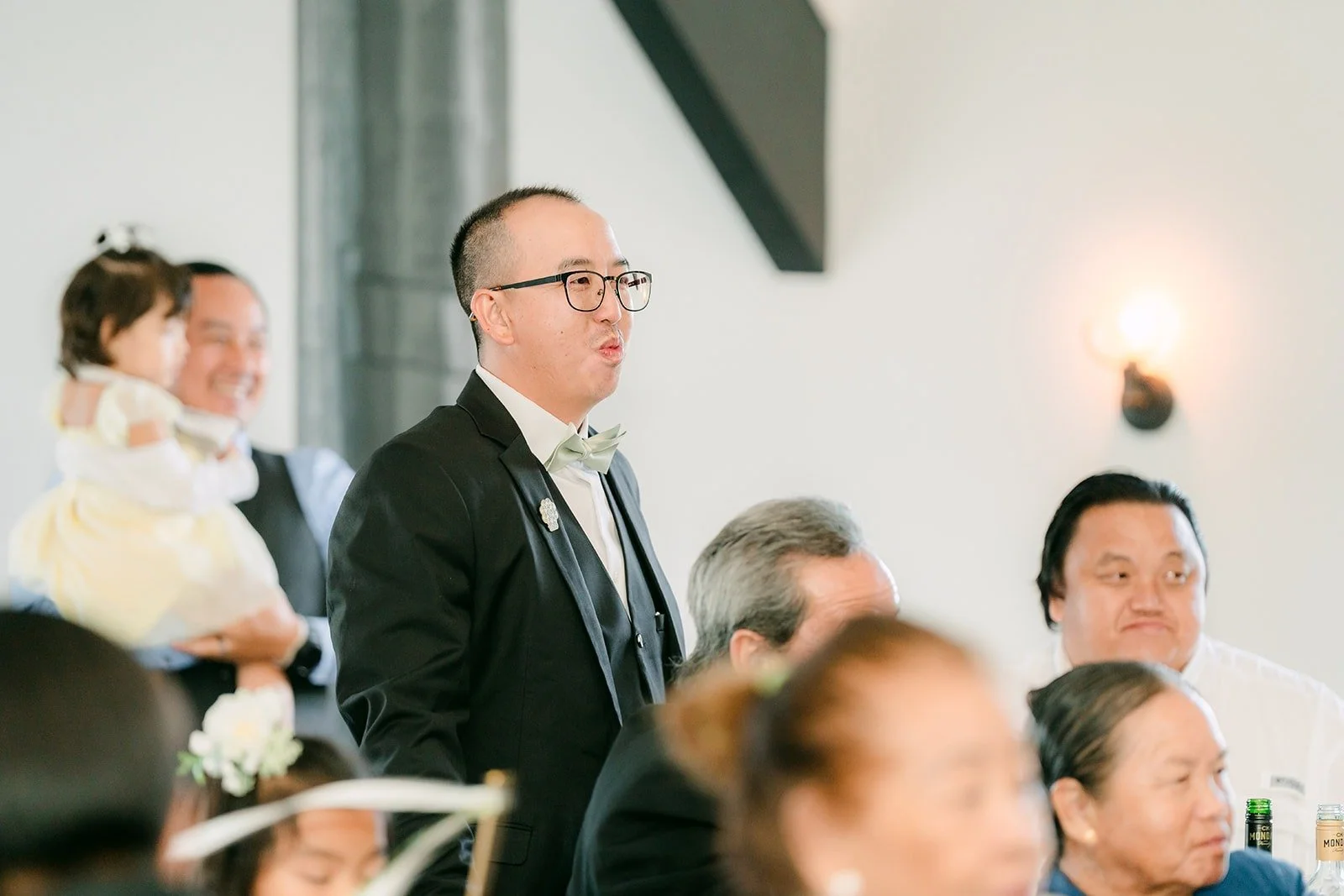 Guests listening at their table
