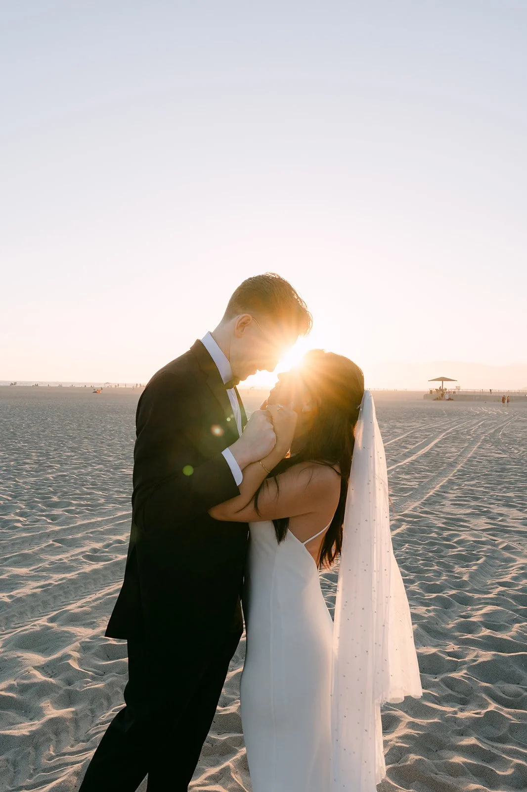A golden hour kiss on the beach